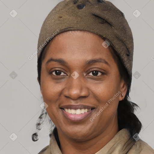 Joyful black young-adult female with short  brown hair and brown eyes