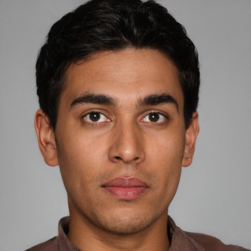 Neutral latino young-adult male with short  brown hair and brown eyes