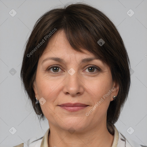 Joyful white adult female with medium  brown hair and brown eyes