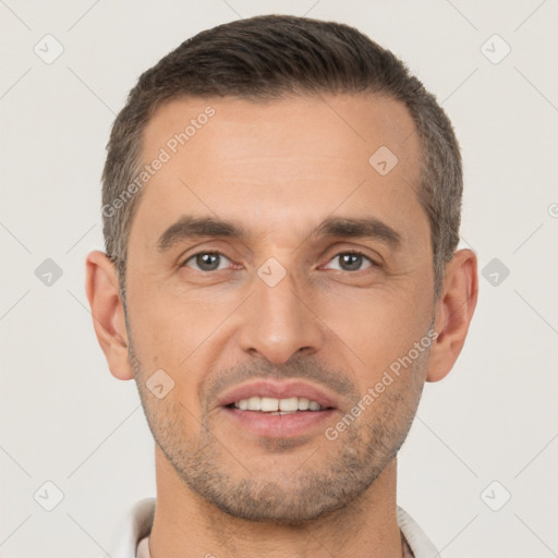 Joyful white adult male with short  brown hair and brown eyes