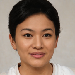 Joyful asian young-adult female with short  brown hair and brown eyes