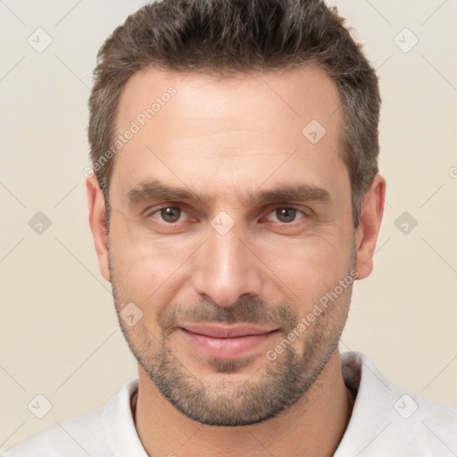 Joyful white adult male with short  brown hair and brown eyes