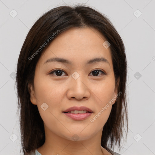 Joyful asian young-adult female with medium  brown hair and brown eyes