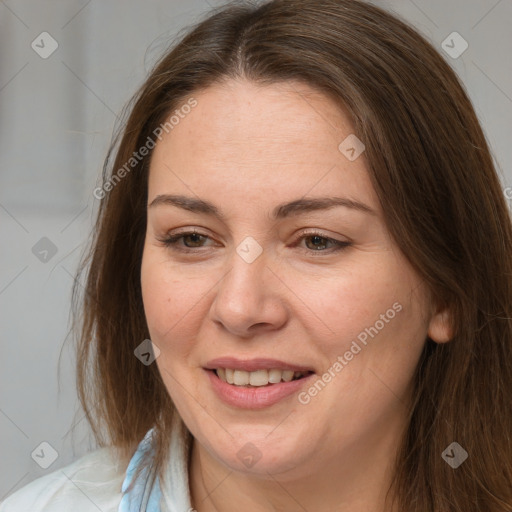 Joyful white adult female with long  brown hair and brown eyes