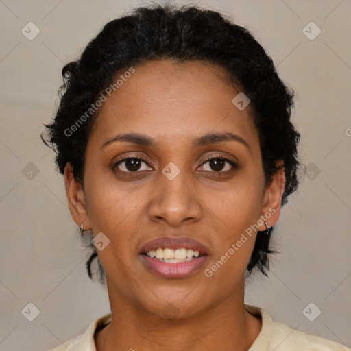 Joyful black young-adult female with short  brown hair and brown eyes