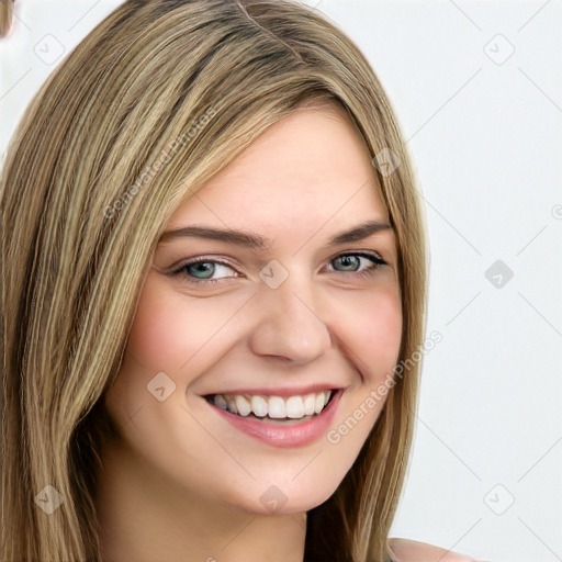 Joyful white young-adult female with long  brown hair and green eyes