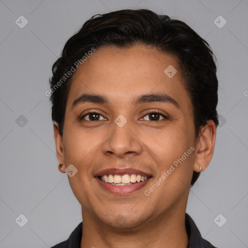 Joyful latino young-adult male with short  brown hair and brown eyes