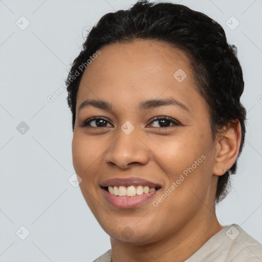 Joyful latino young-adult female with short  black hair and brown eyes