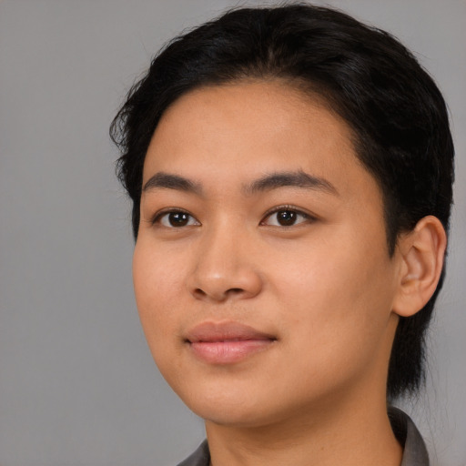 Joyful latino young-adult female with medium  black hair and brown eyes