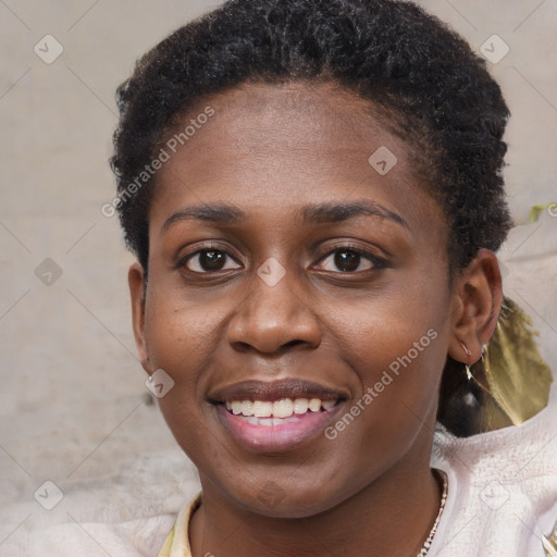 Joyful black young-adult female with short  brown hair and brown eyes