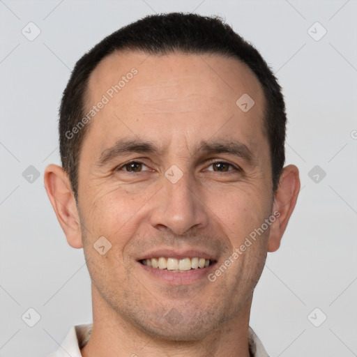 Joyful white adult male with short  brown hair and brown eyes