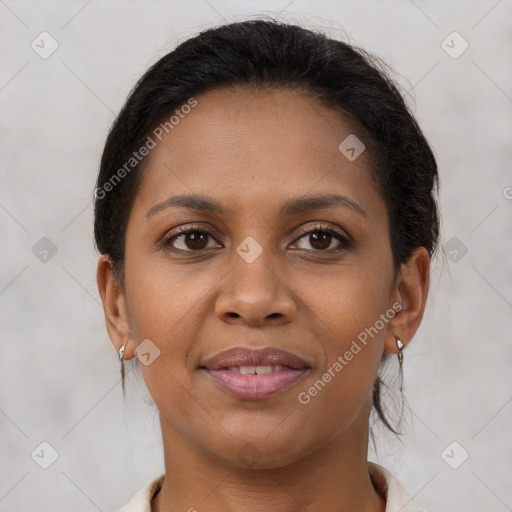 Joyful latino young-adult female with medium  brown hair and brown eyes