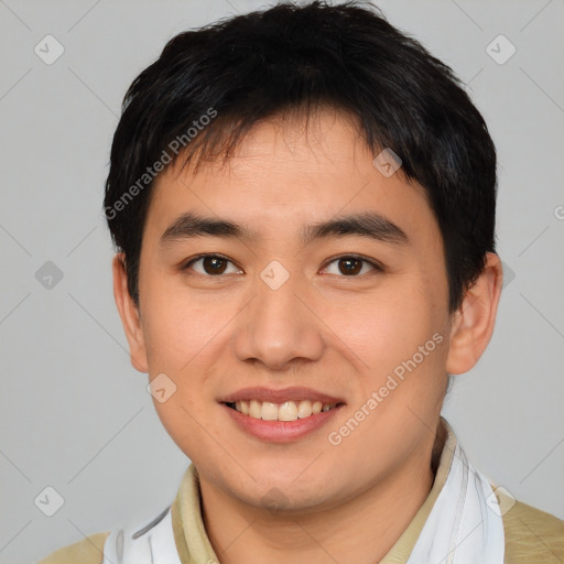 Joyful asian young-adult male with short  brown hair and brown eyes