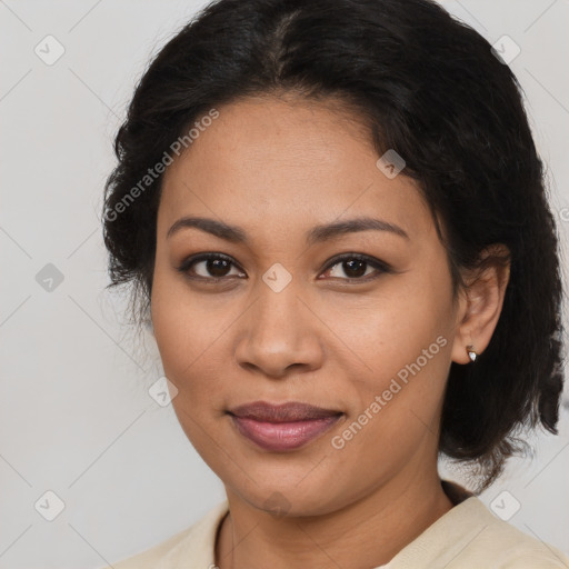 Joyful latino young-adult female with medium  brown hair and brown eyes