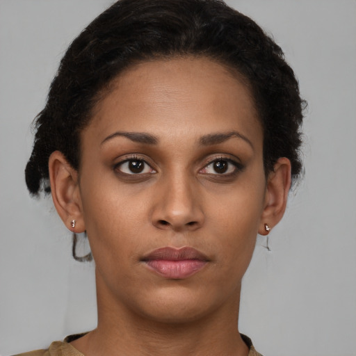 Neutral black young-adult female with short  brown hair and brown eyes