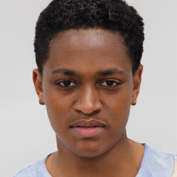 Joyful black young-adult male with short  brown hair and brown eyes