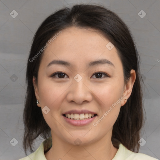 Joyful asian young-adult female with medium  brown hair and brown eyes