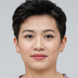 Joyful asian young-adult female with short  brown hair and brown eyes