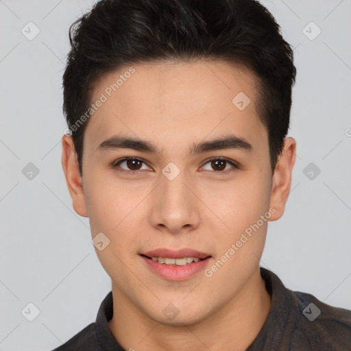 Joyful latino young-adult male with short  brown hair and brown eyes