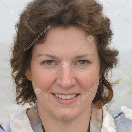 Joyful white adult female with medium  brown hair and blue eyes