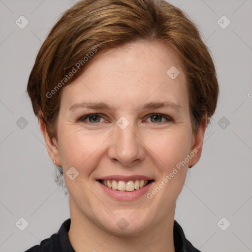 Joyful white adult female with medium  brown hair and grey eyes