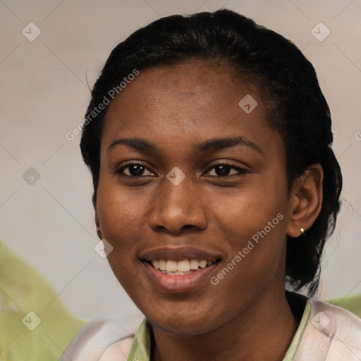 Joyful latino young-adult female with short  black hair and brown eyes