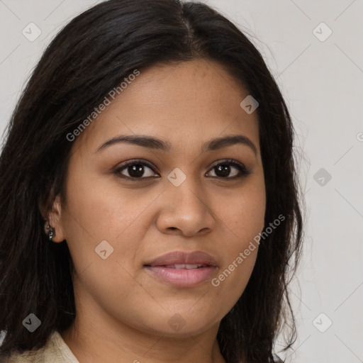 Joyful latino young-adult female with long  brown hair and brown eyes