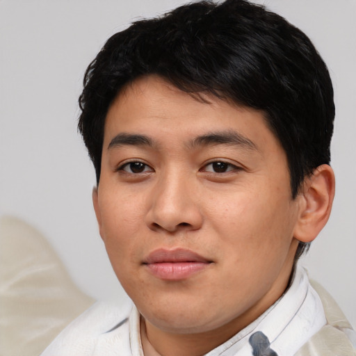 Joyful asian young-adult male with short  brown hair and brown eyes