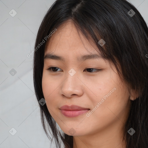 Joyful asian young-adult female with long  brown hair and brown eyes