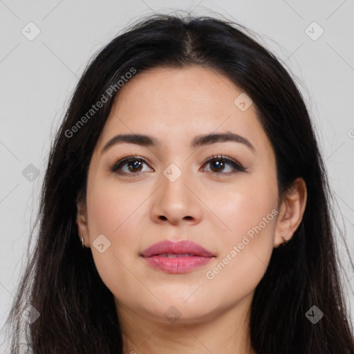 Joyful latino young-adult female with long  brown hair and brown eyes