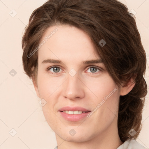 Joyful white young-adult female with medium  brown hair and green eyes