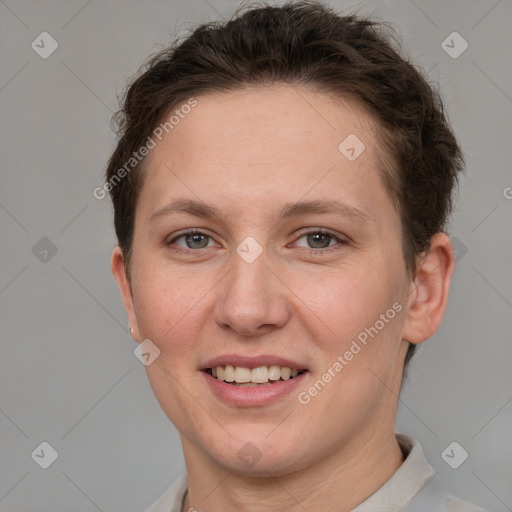 Joyful white adult female with short  brown hair and grey eyes