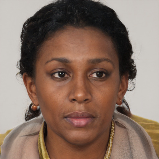 Neutral black young-adult female with short  brown hair and brown eyes