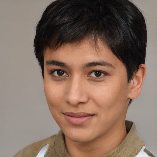 Joyful latino young-adult male with short  brown hair and brown eyes