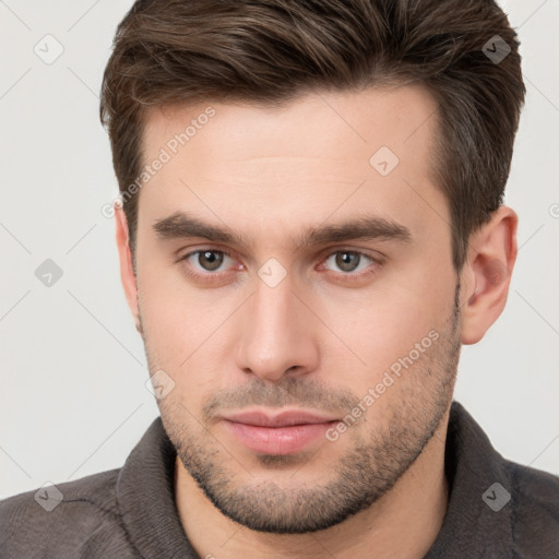 Neutral white young-adult male with short  brown hair and brown eyes