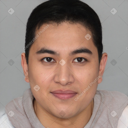 Joyful latino young-adult male with short  brown hair and brown eyes