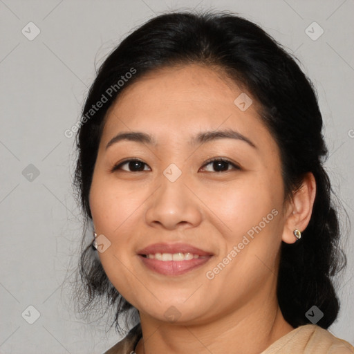 Joyful asian adult female with medium  brown hair and brown eyes