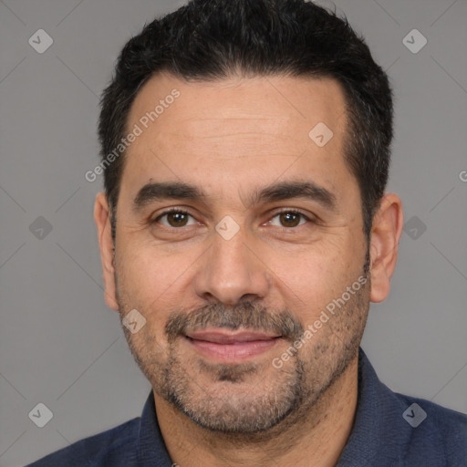 Joyful white adult male with short  black hair and brown eyes