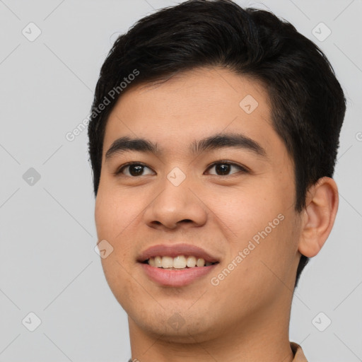 Joyful asian young-adult male with short  black hair and brown eyes