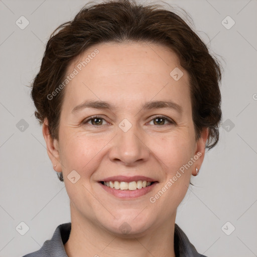 Joyful white adult female with short  brown hair and grey eyes