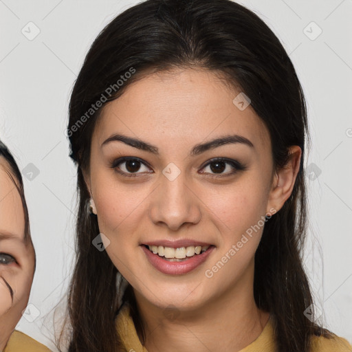 Joyful latino young-adult female with long  brown hair and brown eyes