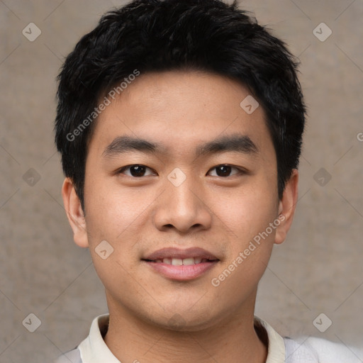 Joyful asian young-adult male with short  black hair and brown eyes