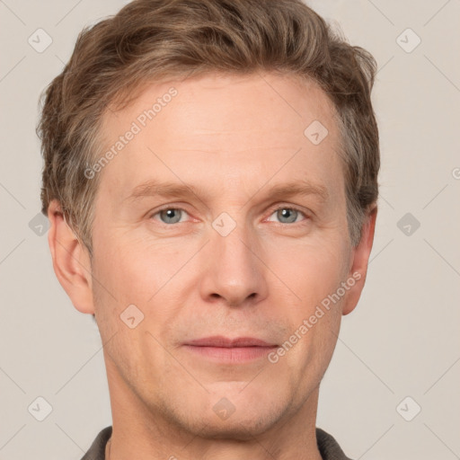 Joyful white adult male with short  brown hair and grey eyes