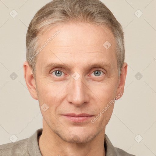 Joyful white adult male with short  brown hair and grey eyes