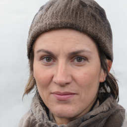 Joyful white adult female with short  brown hair and grey eyes