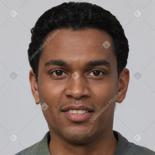 Joyful black young-adult male with short  black hair and brown eyes