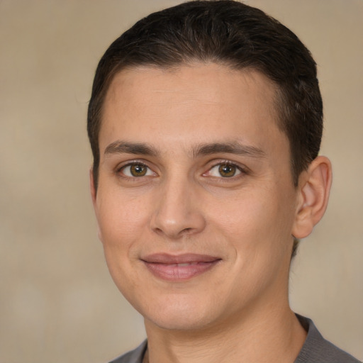 Joyful white young-adult male with short  brown hair and brown eyes