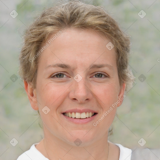 Joyful white adult female with short  brown hair and grey eyes