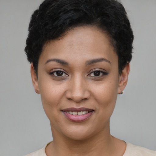 Joyful latino young-adult female with short  black hair and brown eyes