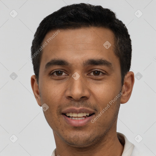 Joyful latino young-adult male with short  black hair and brown eyes